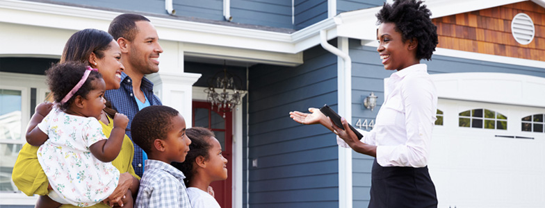 August-blog-06 Family being shown potential home by real estate agent